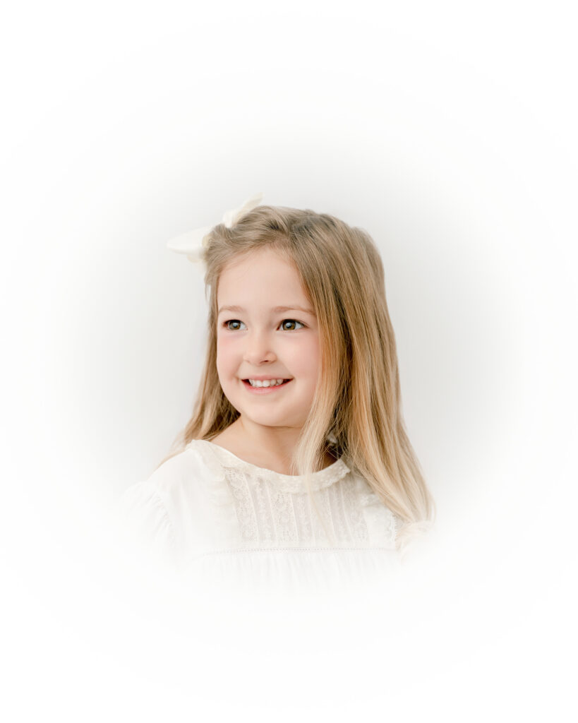 Young girl looking off to the side in a soft, timeless Atlanta heirloom portrait