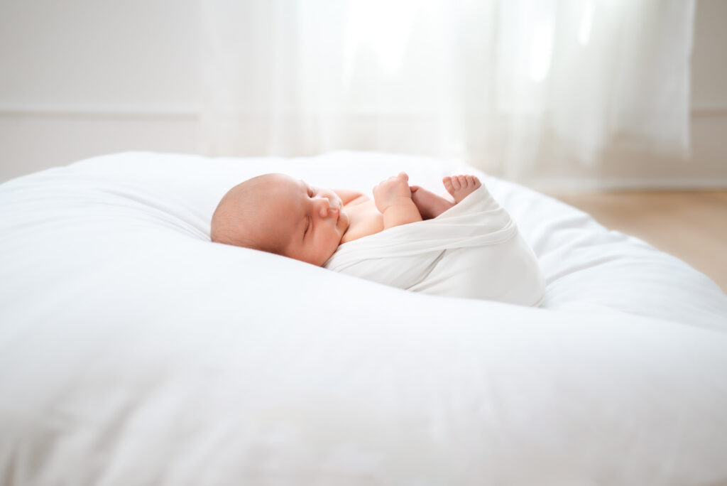 baby laying on beanbag in atlanta newborn session