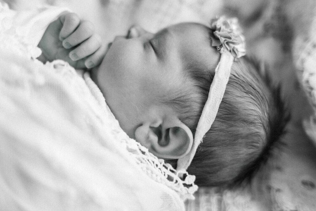 newborn baby girl sleeping during newborn photography session in Duluth