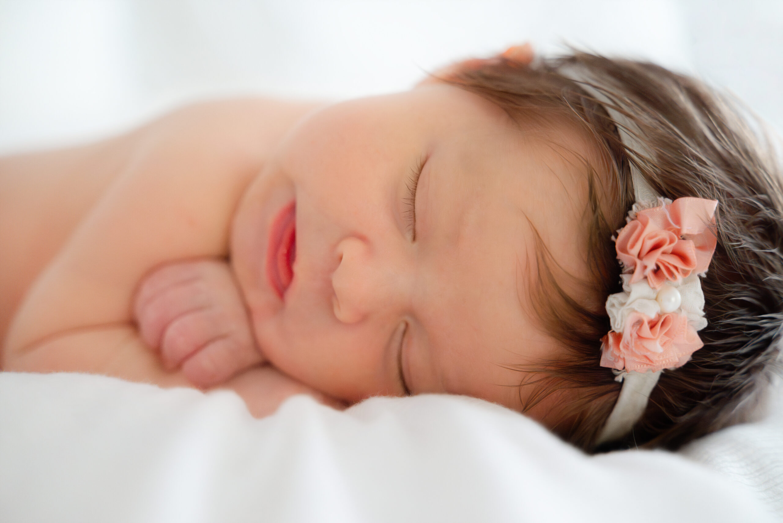 Baby girl sleeping in Cumming Newborn Photography Session